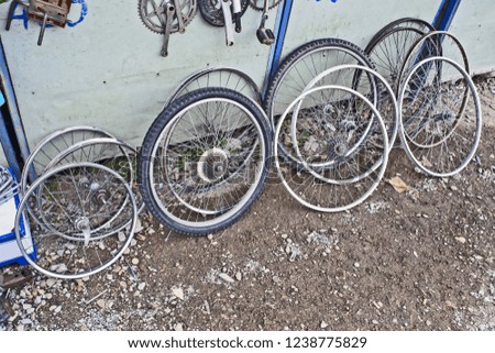  Spare wheels for bicycles sold in the flea market.