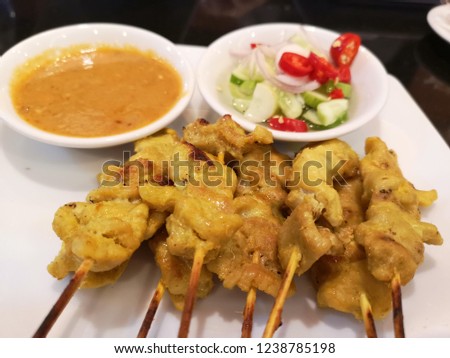 Grilled pork with seasoning, satay, on the table.