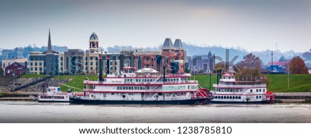 Cincinnati Kentucky riverfront on the Ohio river with tug boats and paddle boats over looking towards Covington Kentucky skyline Urban exploration photography