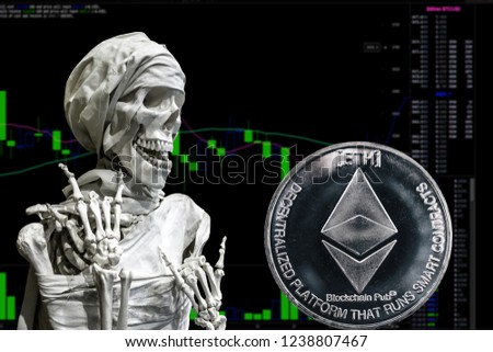Coin cryptocurrency Ethereum and skeletonon a background chart.