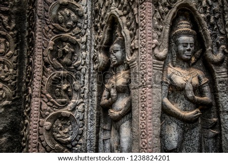 Ta Prohm Angkor Wat Cambodia. The ancient temple of Ta Prohm at Angkor Wat, Cambodia where roots of the jungle trees intertwine with the masonry of these ancient structures producing surreal world. Royalty-Free Stock Photo #1238824201