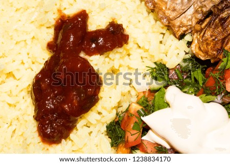 Lunch of rice, fish and salad.Background fish with rice.