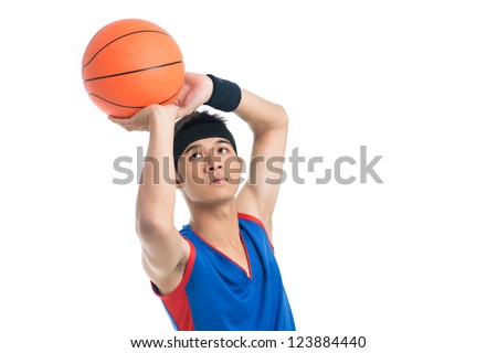 Isolated image of a basketball player being about to throw a ball