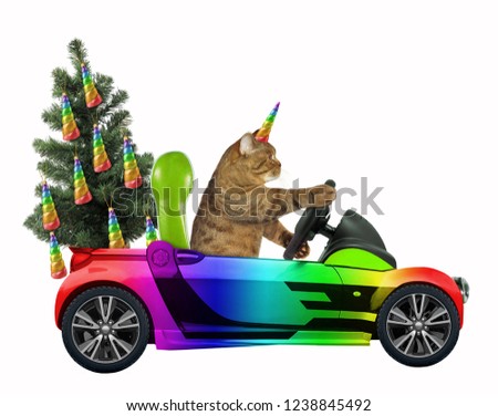 The cat unicorn carries a Christmas tree in the rainbow car. White background.