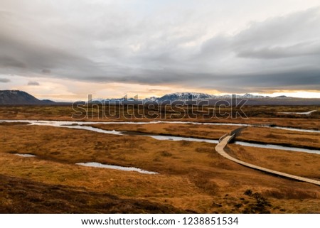 Travel  - Iceland Trip, Open field with lagoon with mountain background view from Þingvellir