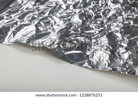 Aluminum foil roll for background, close up.