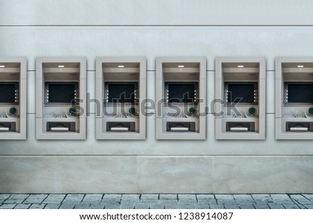 Modern street ATMs for withdrawal of money and other financial transactions.