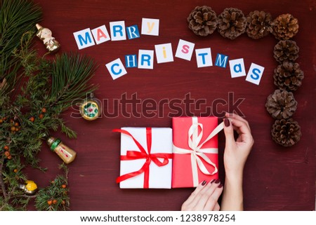 hands Christmas background with White Christmas tree gifts new year holiday winter