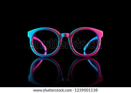 Stylish sunglasses shot using pink and blue abstract colored lighting with copy space. Royalty-Free Stock Photo #1239001138