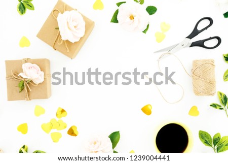 Frame composition with gentle roses, gifts, scissors, coffee mug and confetti on white background. Flat lay, top view. Valentines day.