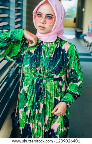 young beautiful hijab teacher wearing trendy fashion spectacle