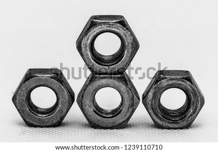 Metal nut on a white background. Can be used in various tasks.