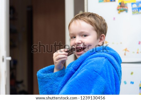 Family in focus: portrait of a happy cute child with food