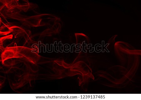 Movement of red smoke abstract on black background, fire design