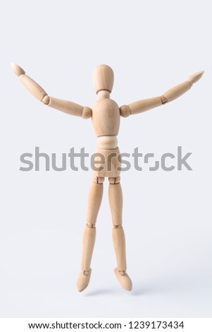 Business and design concept - wooden mannequin with open arm gesture isolated on white background