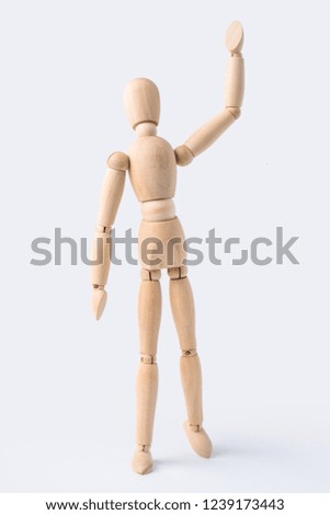 Business and design concept - wooden mannequin with welcome gesture isolated on white background