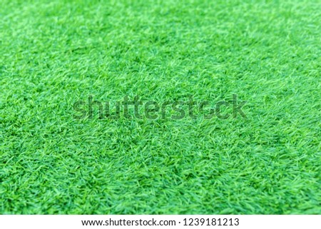 Dept of field with artificial green grass or astroturf for background