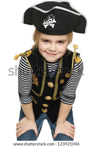 Grinning little girl wearing pirate costume, over white background