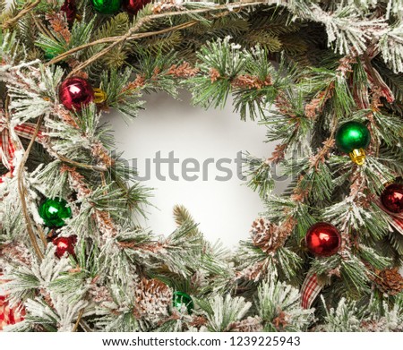 Christmas frame background with baubles decor and snow fir tree. Isolated on white background with copy space. Floral New Year frame. Border with copy space.