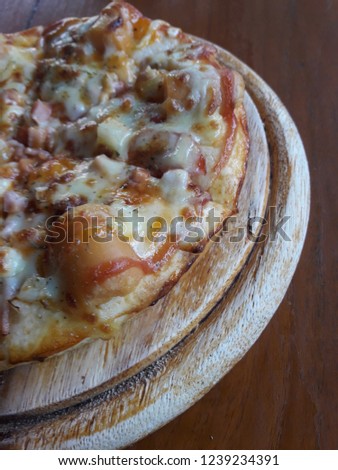 Pizza in a wooden tray