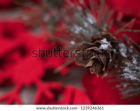New Year's background red color, fir-tree branch with cones