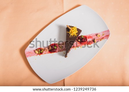 Chocolate mousse, a large piece of chocolate cake on a plate