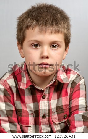 child making ugly faces in gray 10