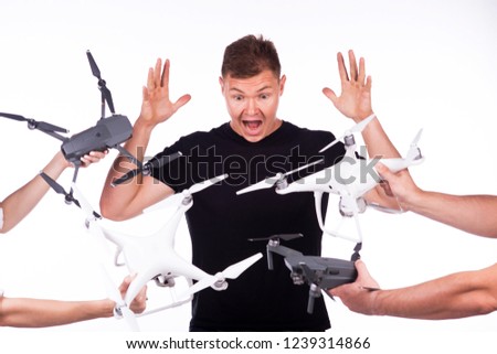 Boy and girl hold flying drones in their hands and smile. Theme selling and buying drone. On a white background.