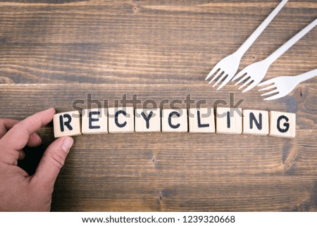 Recycling. Wooden letters on the office desk, informative and communication background