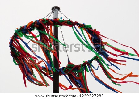 Maypole set-up, customs with a long tradition, Germany. Colorful Ribbons. Beautiful Background.