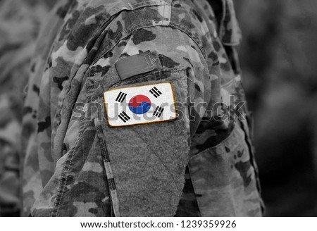 South Korea flag on soldiers arm (collage). Royalty-Free Stock Photo #1239359926