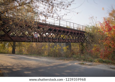 Walking bridge in the countryside Royalty-Free Stock Photo #1239359968