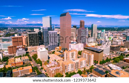 colorful Colorado above Denver , Colorado , USA skyline cityscape capital cities downtown towers rising up with the Rocky Mountain background summer sunshine