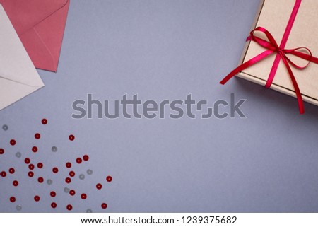 Gray background with gift envelopes and gift box
