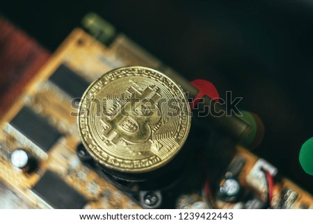 Bitcoin and electronic microcircuit, video card. Technology blockchain, cryptocurrency.