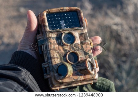 field camera or trail camera for capturing candid photos and videos of wild animals Royalty-Free Stock Photo #1239448900