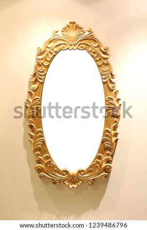 Gold decorative picture frame on wall background