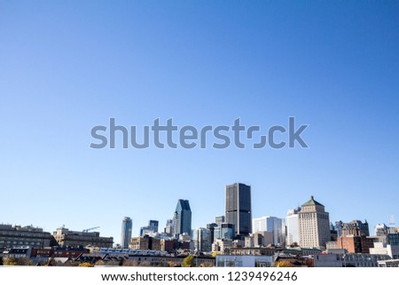 Montreal skyline, with the iconic buildings of the old Montreal (Vieux Montreal) and business skyscrapers taken from the port. Montreal is the main city of Quebec, & the second city in Canada