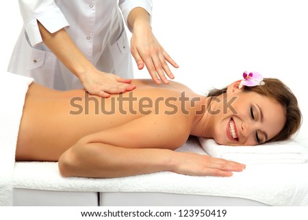 beautiful woman in spa salon  getting massage, isolated on white