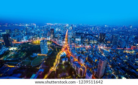 Asia Business concept for real estate and corporate construction - panoramic modern city skyline aerial night view of road junction like starfish under blue sky in Tokyo, Japan