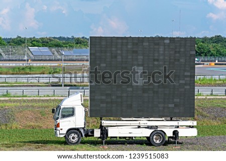 Billboard on white truck advertising : LED pixel display panel for sign Advertising on outdoor background cloudy sky.
multiple purpose indoor and outdoor LED display screen.
