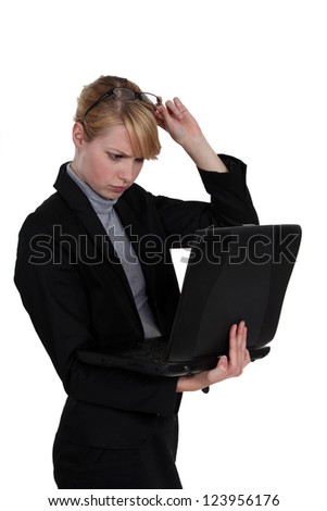 Woman frowning at her laptop