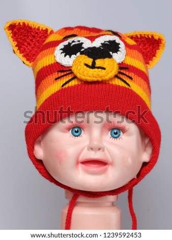 colored knitted children's winter hat made of wool