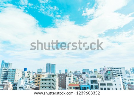 Asia Business concept for real estate and corporate construction - panoramic modern city urban skyline bird eye aerial view under sun and blue sky in koto district, Tokyo, Japan