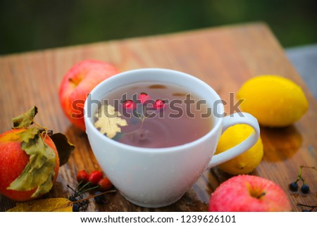 tea and fruit are on the table is raining