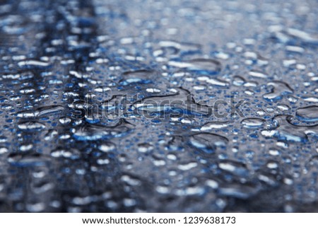 Rain drops on a glass table