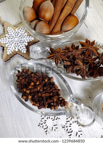 Anise stars, nuts, vanilla sticks, cloves, cinnamon sticks - aromatic spices for desserts, cakes and Christmas and seasonal spices