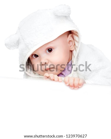 little baby in white bear costume isolated on white background with empty white board