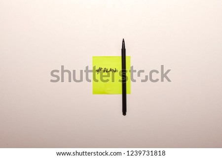 pen and note on a white background