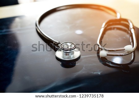 Stethoscope with x-ray on the desk